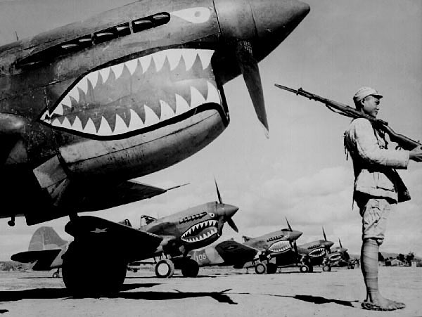 CHINESE SOLDIER GUARDS FLYING TIGERS P-40s.