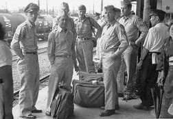 Tiger Lil crew at Tachikawa train station waiting to go to Yamanaka Hotel for R & R, 1950